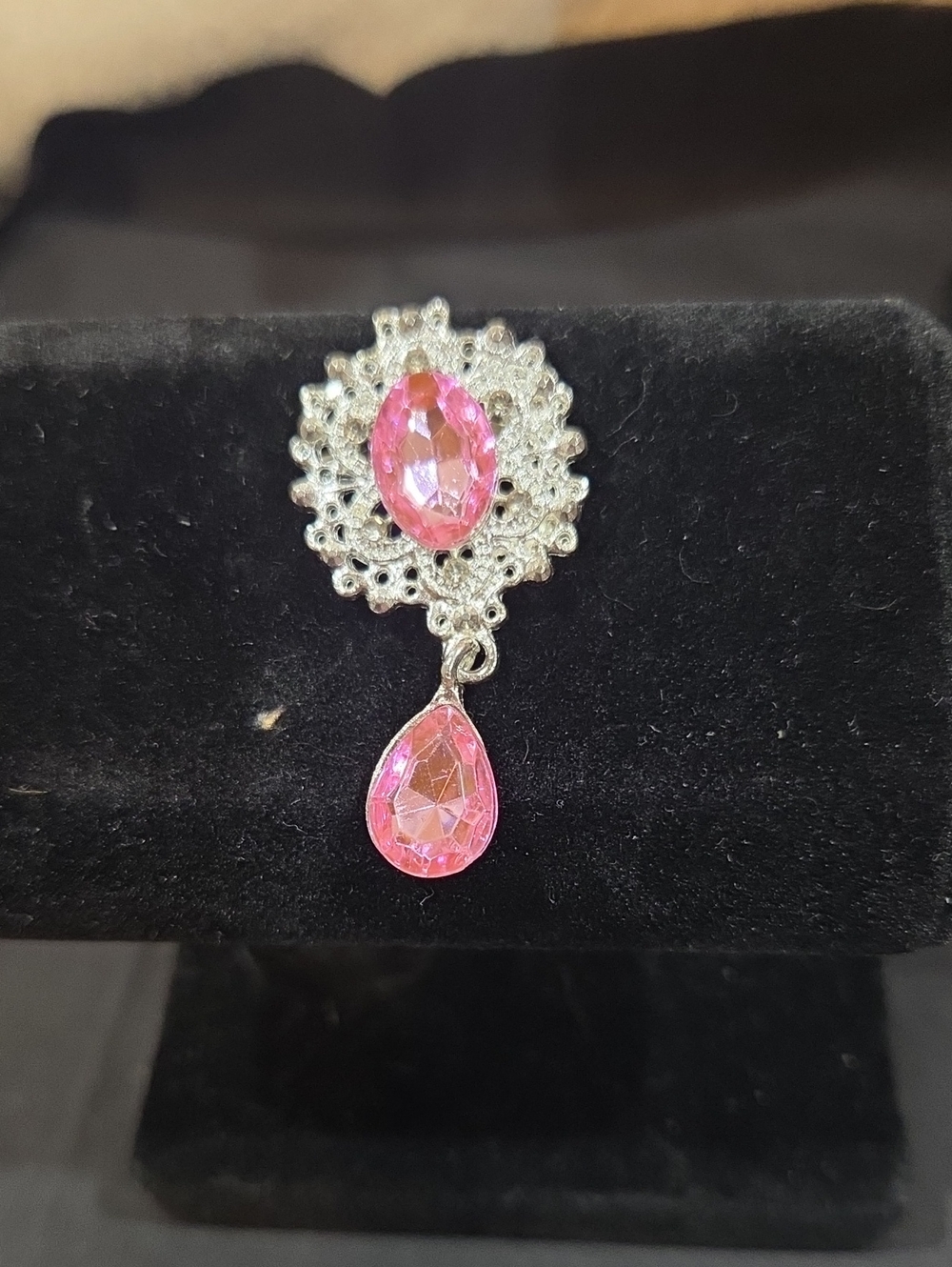 SILVER-TONE BROOCH WITH PINK RHINESTONE CENTER